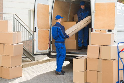 Removal team supporting a home move in Putney with boxes and furniture