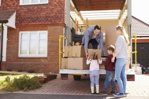 Moving team preparing a house removal in Putney on a residential street