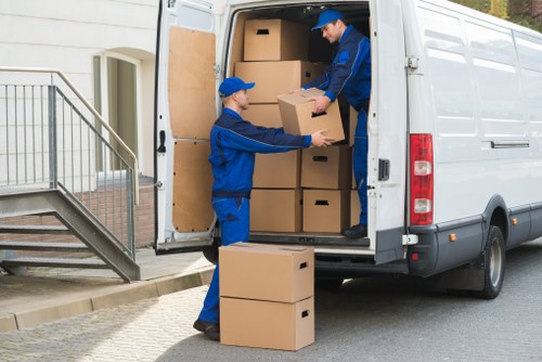 Furniture removals team handling household items in Putney