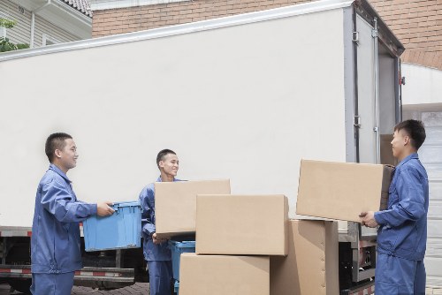 Man and van loading furniture for a move in Putney