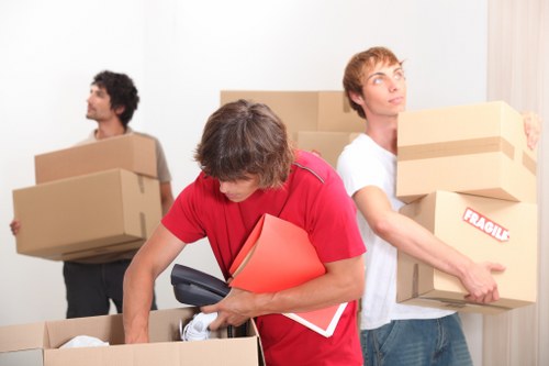 Business furniture and boxes arranged for an office move in Putney