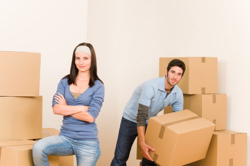 Packing fragile household items for a move in Putney