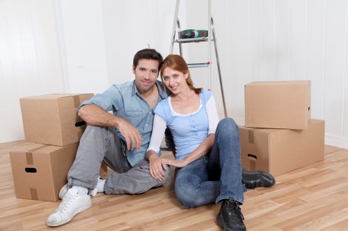 Careful loading of household items during a Putney flat removal
