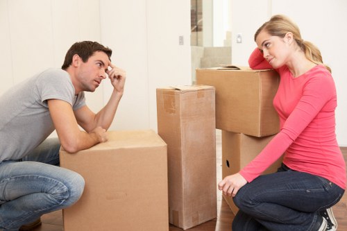 Piano movers planning access and lifting route in a Putney property