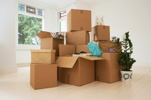 Packed boxes and furniture ready for apartment removals in Putney