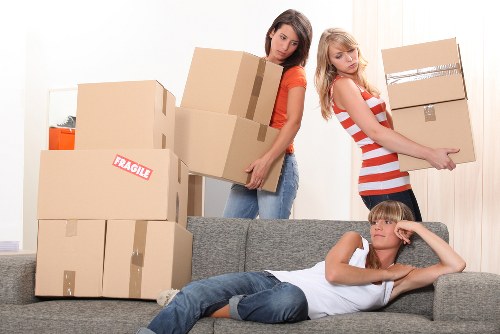 Organised moving boxes ready for unpacking in a Putney home