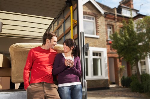 Professional removals service handling items inside a Putney property